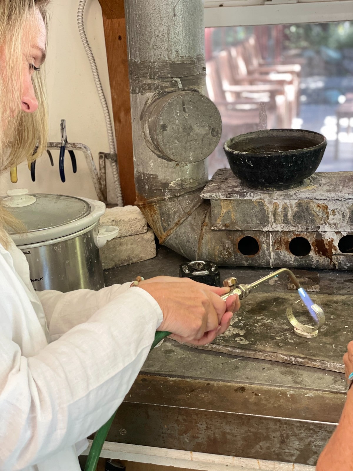 Jill holding a welding torch