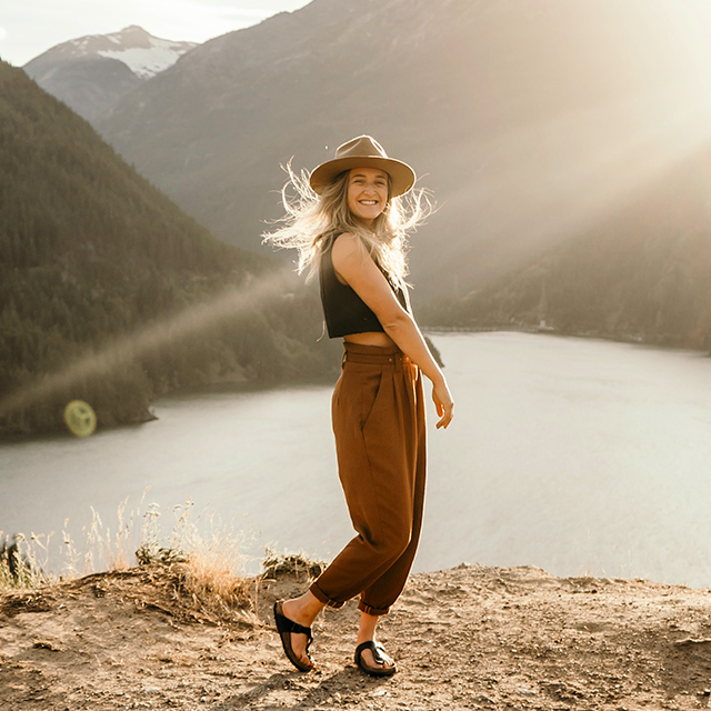 Portrait of Katrina on the top of a cliff