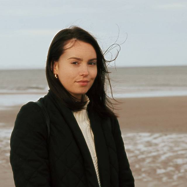 Portrait of Larissa along a sandy beach