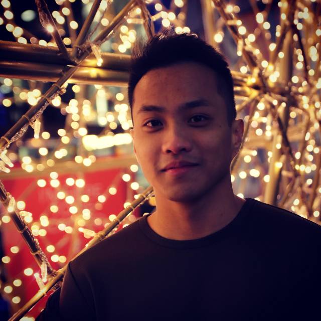 Portrait of Vince in front of christmas lights