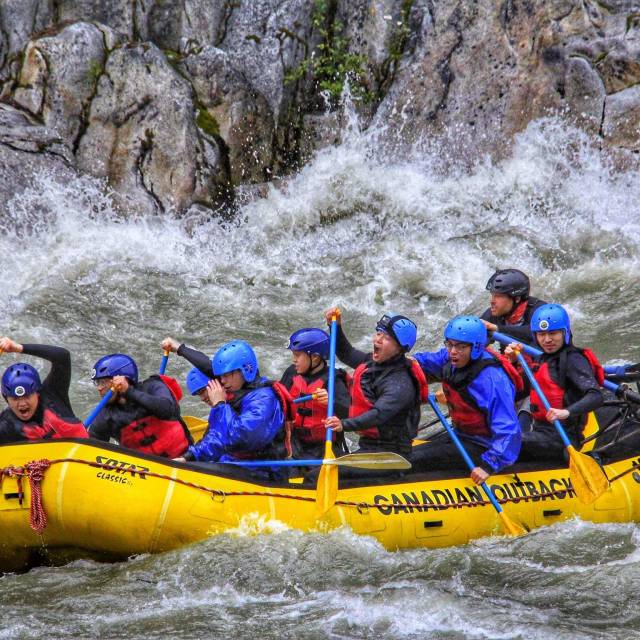 Photo of Vince and friends mid-action of a white rafting
