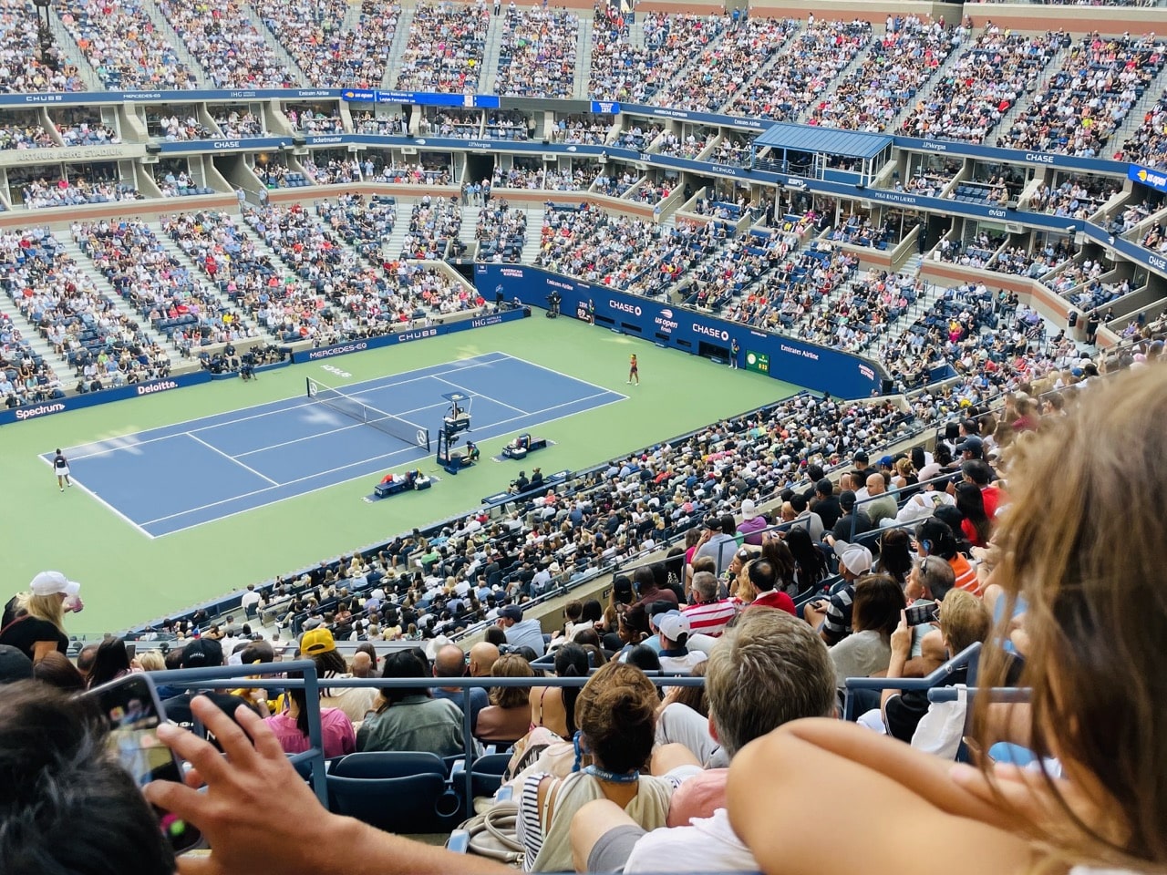 Wide shot of a stadium during a tennis tournament